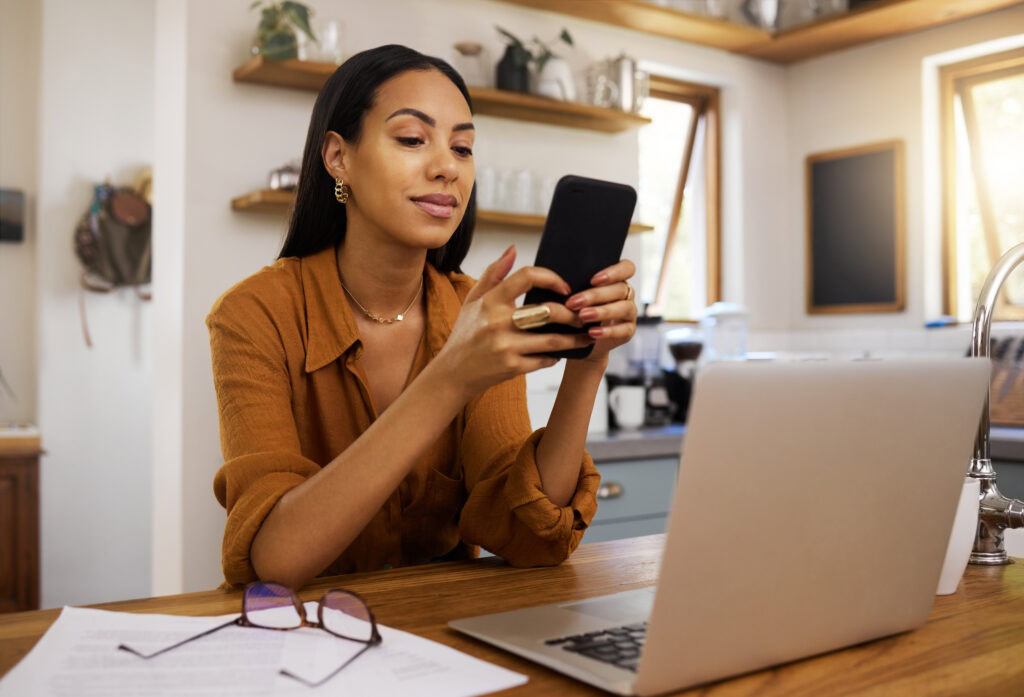 Woman looking at home services companies on her phone.