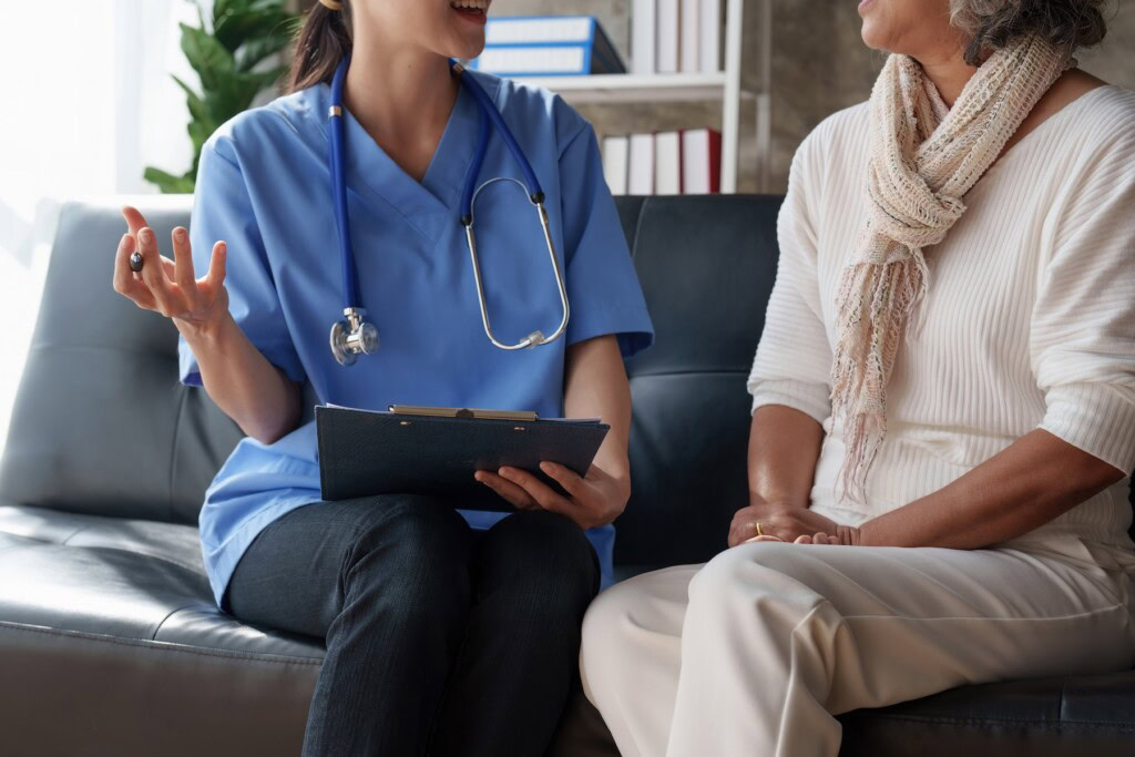 Healthcare nurse meeting with a senior adult woman